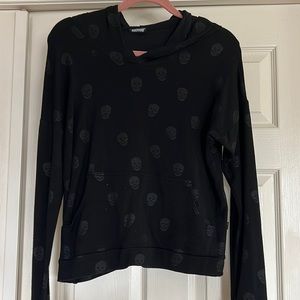 Black sweatshirt with star eyed skulls